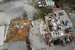 Florida'da Sally kasırgasının yıktığı evler.